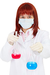 Image showing Young woman - scientist with chemical reagents