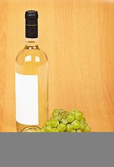 Image showing Bottle of white wine and grapes