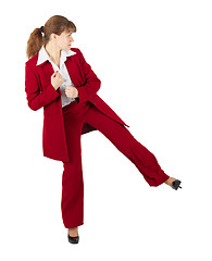 Image showing Beautiful girl in business suit kicks