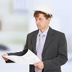 Image showing Man in helmet with drawing in hands