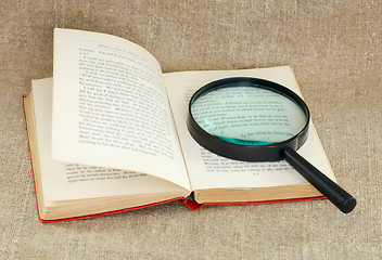 Image showing Still life of magnifying glass and old book