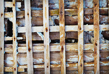 Image showing Old wooden lattice - old skeleton of concrete wall