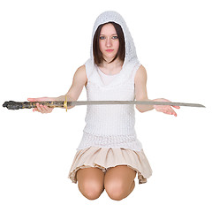 Image showing Teenage girl sitting on the lap with traditional Japanese sword 