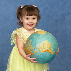 Image showing Beautiful little girl with globe