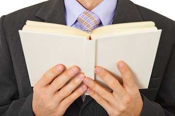 Image showing Man in suit reads book