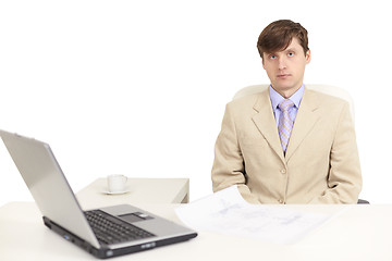 Image showing Young serious person on a workplace
