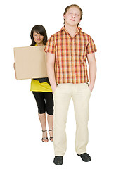 Image showing Woman and man bear the big cardboard box