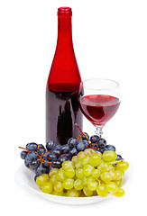 Image showing Bottle of red wine, glass and grapes on white background