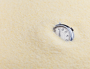 Image showing Composition on Zen garden - sand, and watch