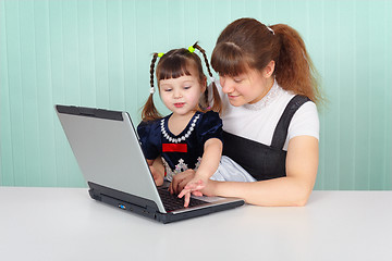 Image showing Mom shows daughter work on computer