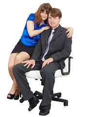 Image showing Young people - man and woman sitting on chair