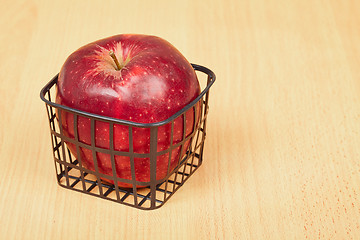 Image showing Red apple in a small basket