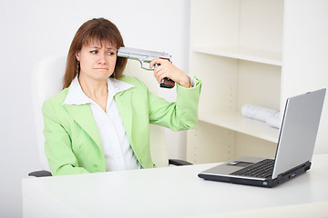 Image showing Girl shoots himself in head in office - an attempt to commit sui