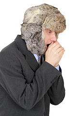 Image showing Young man in fur cap freezes