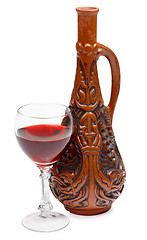 Image showing Ancient Georgian bottle and glass of wine on white background