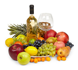 Image showing Still Life - heap of fruits and bottle of white wine