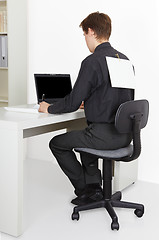 Image showing Man working in office, attach to back poster