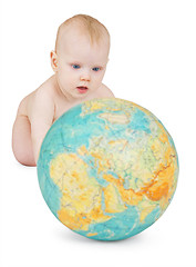 Image showing baby playing with globe of earth