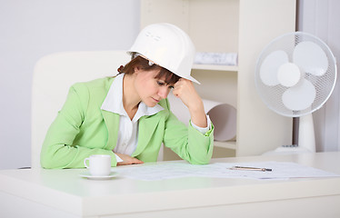 Image showing Tired woman engineer in workplace