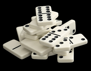 Image showing Heap of dominoes isolated on black background