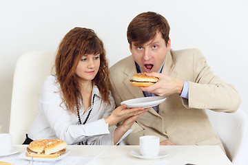 Image showing A pair of businessmen lunching in workplace