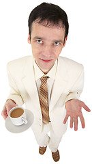 Image showing Young man in white suit with coffee