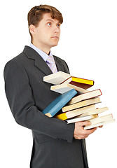 Image showing Student holds a lot of books
