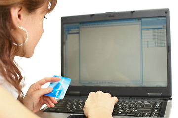 Image showing Woman pays credit card when buying online