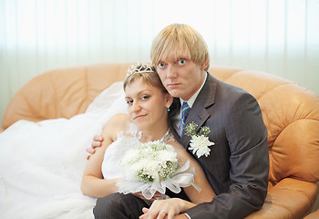 Image showing Future husband and wife on leather sofa