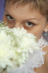 Image showing Bride with bouquet - eyes closeup