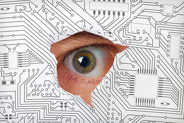 Image showing Eye looking through a hole in electronic circuit