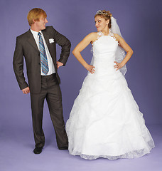 Image showing Funny Newlyweds standing on blue