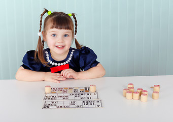 Image showing Child at table played with bingo