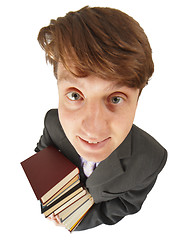 Image showing Funny guy with pile of books