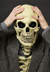 Image showing Amusing scared person in mask - skull