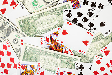 Image showing Background of playing cards and money - theme of gambling