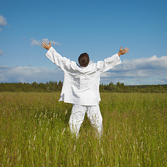 Image showing Man enjoys nature and fresh air in a field