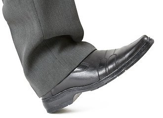 Image showing Foot in a shoe ready to crush