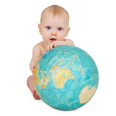 Image showing Baby sitting on white background with globe