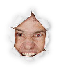 Image showing Violent evil man looks through a hole