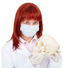 Image showing Woman - nurse with skull in hands