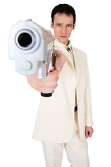 Image showing Man in suit aims us in face with pistol