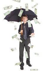 Image showing Businessman came under rain of money