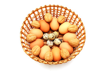 Image showing Eggs and quail egg in the basket