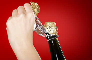 Image showing Opening champagne bottle