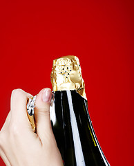 Image showing Opening champagne bottle