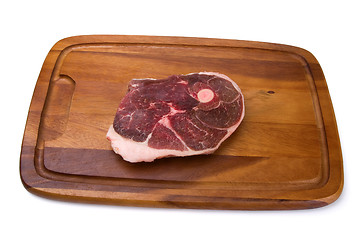 Image showing Raw meat on the wooden board