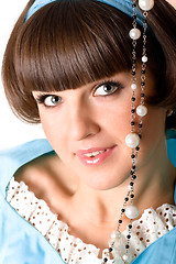 Image showing woman in blue dress with pearl beads