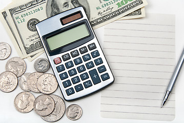 Image showing Calculator, empty lined paper, money and pen