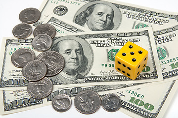 Image showing Yellow dice and money